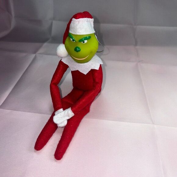 Red Grinch on a shelf - Picture 1 of 3